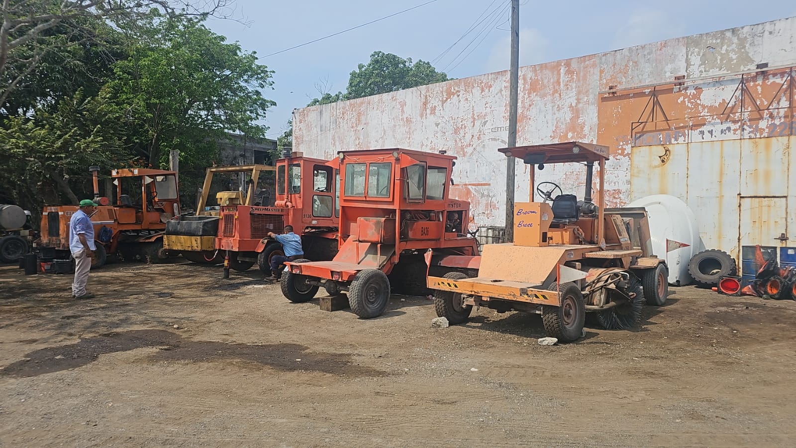 Pneumatic rollers, sweepers and tack coat distributors